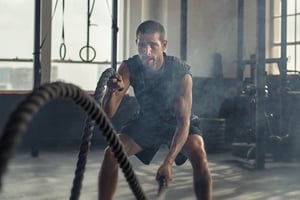 bigstock-Strong-young-man-working-out-w-303319519